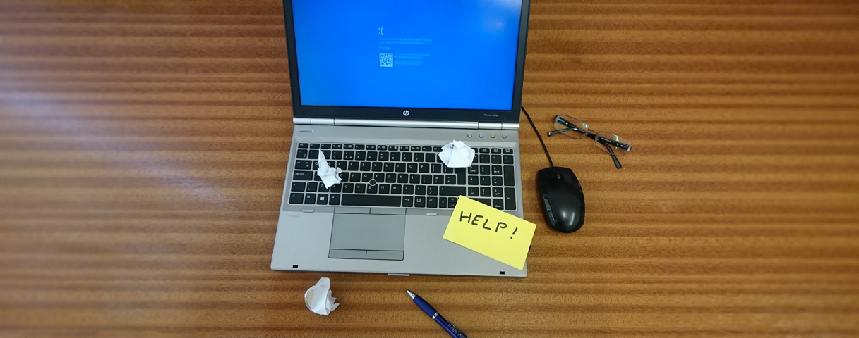 IT help desk engineer working at a computer
